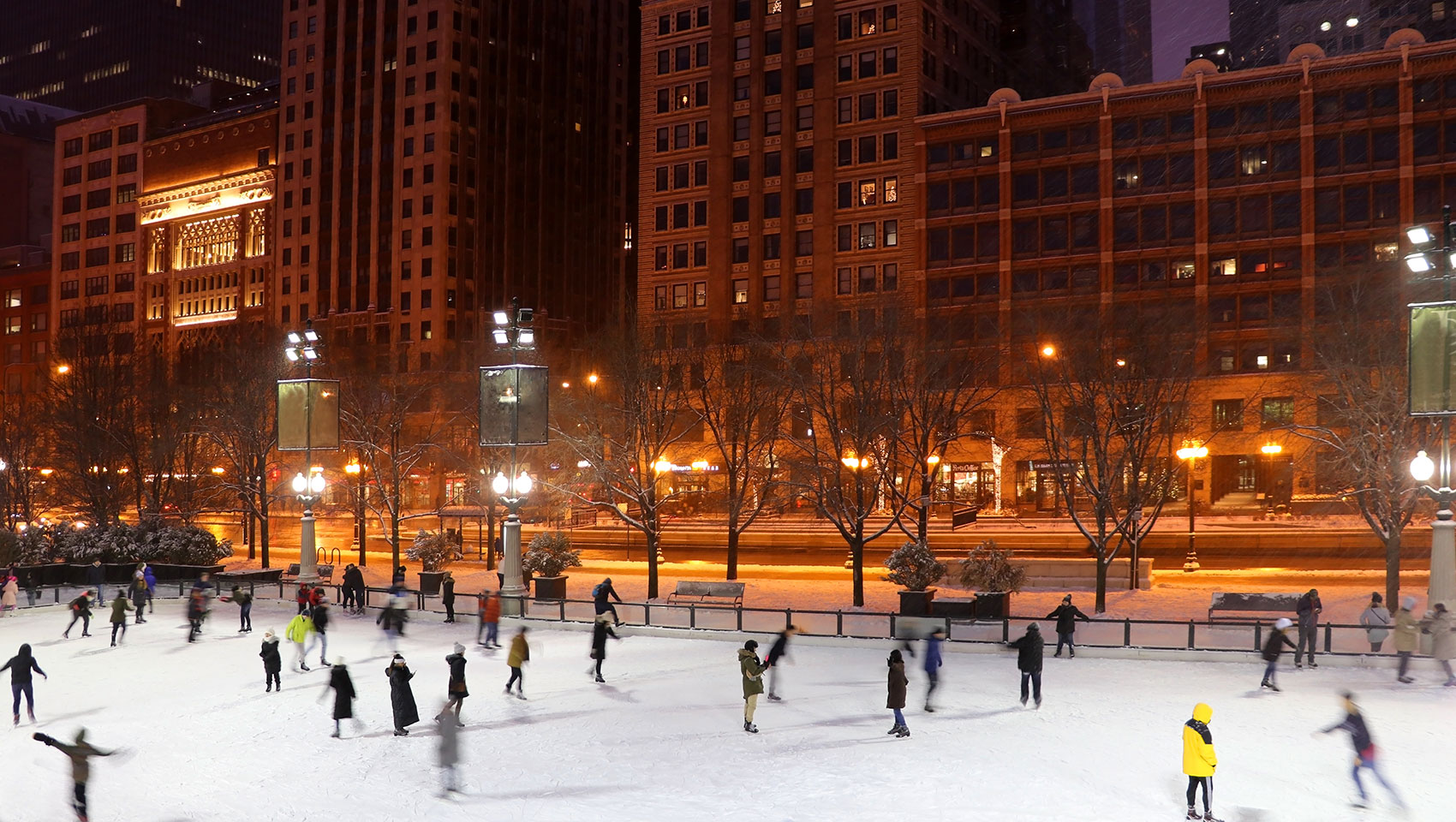 People skating on outdoor city rink