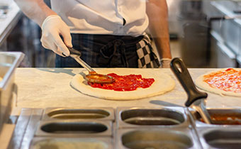 chef preparing a piiza