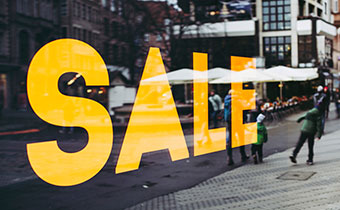 SALE sign in store window