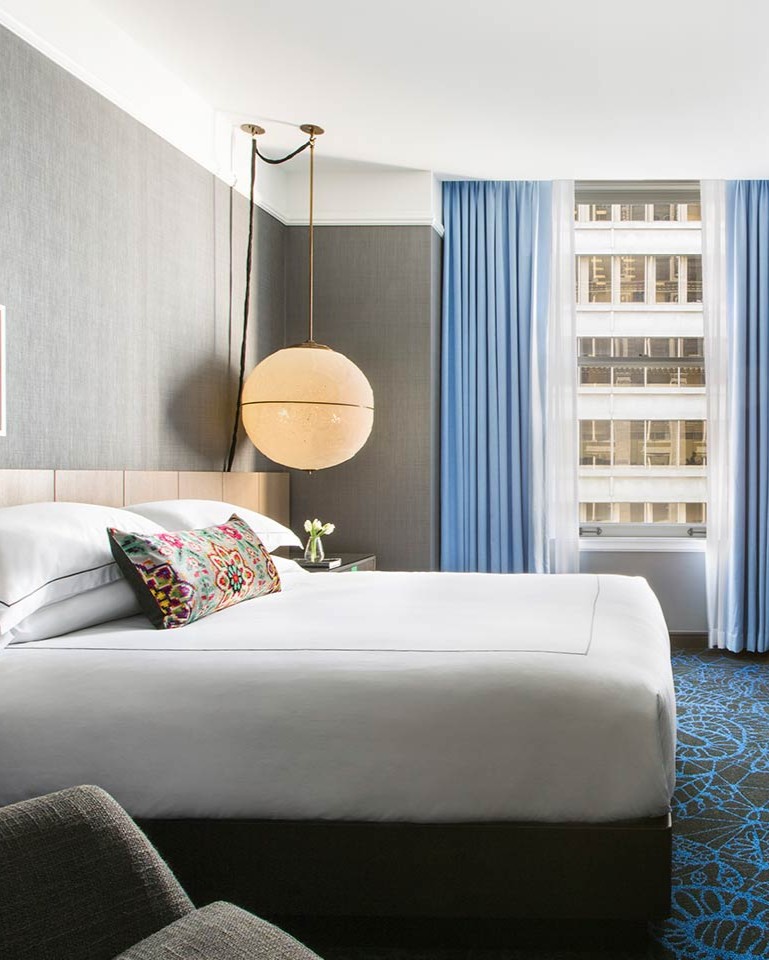 King guest room with a city view at Kimpton Gray Hotel